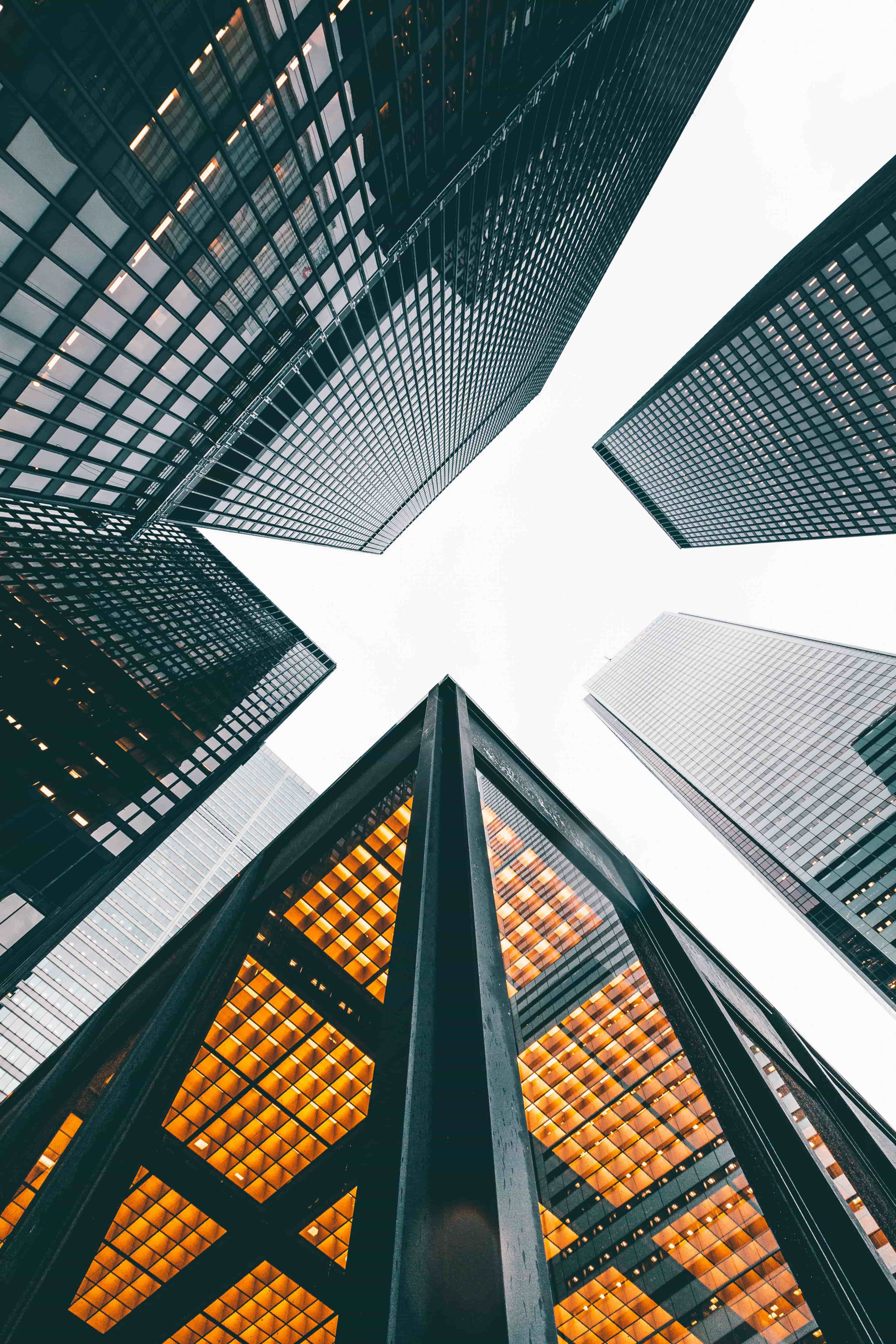 Looking up at the skyscrapers in Toronto, Canada's financial district. Corner of a building with golden ceiling lights.